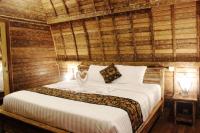 Umma Bali Menjangan Retreatにあるベッド