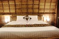Umma Bali Menjangan Retreatにあるベッド