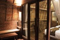 Umma Bali Menjangan Retreatにあるベッド