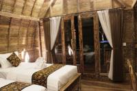 Umma Bali Menjangan Retreatにあるベッド
