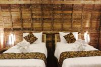 Umma Bali Menjangan Retreatにあるベッド