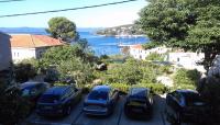 a group of cars parked in a parking lot at Apartments and rooms Rest - close to the sea &amp; comfortable in Sumartin