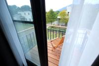 a view of a balcony with a chair and a window at Chuying Sunrise B&amp;B in Ji&#39;an