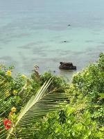 a view of the ocean with a rock in the water at Oon Lee Bungalows in Ko Jum