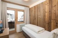 Posteľ alebo postele v izbe v ubytovaní Angerer Alpine Suiten und Familienappartements Tirol