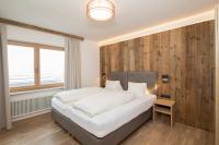 Posteľ alebo postele v izbe v ubytovaní Angerer Alpine Suiten und Familienappartements Tirol