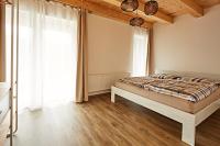 Postel nebo postele na pokoji v ubytování Mountain Apartments Klínovec Hexagon