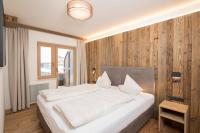 Posteľ alebo postele v izbe v ubytovaní Angerer Alpine Suiten und Familienappartements Tirol