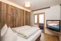 Televízia a/alebo spoločenská miestnosť v ubytovaní Angerer Alpine Suiten und Familienappartements Tirol