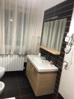 Kúpeľňa v ubytovaní RAJA ROOMS