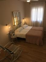 Posteľ alebo postele v izbe v ubytovaní Urban Suites El Postigo