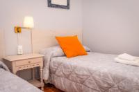 Cama o camas de una habitación en Apartamentos Cudillero