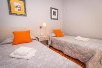 Cama o camas de una habitación en Apartamentos Cudillero