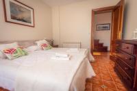 Cama o camas de una habitación en Apartamentos Cudillero