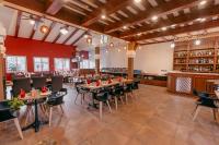a restaurant with tables and chairs and a bar at Hotel Manang - Thamel, Kathmandu in Kathmandu