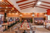 a dining room with wooden tables and chairs at Hotel Manang - Thamel, Kathmandu in Kathmandu