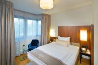 Łóżko lub łóżka w pokoju w obiekcie Hotel Maximilian - Stadthaus Penz