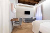 Televízia a/alebo spoločenská miestnosť v ubytovaní Poēsis Experience Hotel