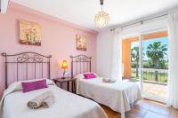 Postel nebo postele na pokoji v ubytování Villa Golf Sanlucar