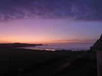 a view of the ocean at sunset at Oceanside Lifestyle Hotel in Newquay