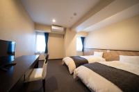 HOTEL CITY INN WAKAYAMA 和歌山駅前にあるベッド