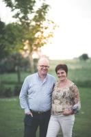 a man and a woman standing in a field at B&amp;B Nieuwhof in Gistel