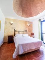 Postel nebo postele na pokoji v ubytování Paradise Villa