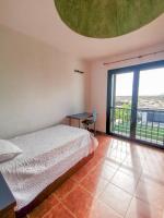 Postel nebo postele na pokoji v ubytování Paradise Villa