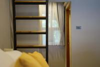 Postel nebo postele na pokoji v ubytování Yellow Pillow village