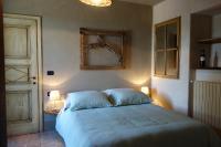 A bed or beds in a room at Locanda degli Ultimi
