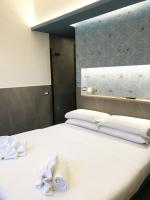 Posteľ alebo postele v izbe v ubytovaní Ottaviano Smart Rooms