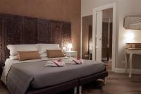 A bed or beds in a room at Real Giardinetto a Toledo