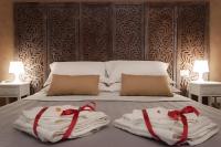 A bed or beds in a room at Real Giardinetto a Toledo