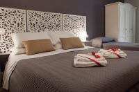 A bed or beds in a room at Real Giardinetto a Toledo