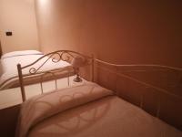 A bed or beds in a room at The Como Secret Garden