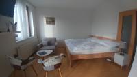 Postel nebo postele na pokoji v ubytování Vitkov Park Apartment
