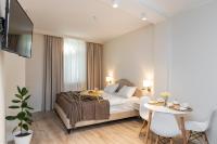 a hotel room with a bed and a table at Pomegranate in Old Tbilisi in Tbilisi City