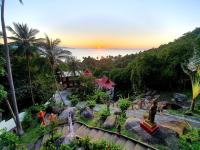 an aerial view of a resort with the sunset in the background at Moonstone Studio in Haad Rin
