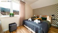 Posteľ alebo postele v izbe v ubytovaní Wonder Home - Apartamenty w malowniczej okolicy, z balkonami i widokiem na góry