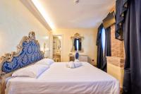 Hotel Vecellio Venice on the Lagoonにあるベッド