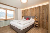 Posteľ alebo postele v izbe v ubytovaní Angerer Alpine Suiten und Familienappartements Tirol
