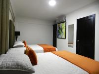 Postel nebo postele na pokoji v ubytování Hotel La Colonia