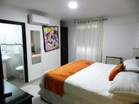 Postel nebo postele na pokoji v ubytování Hotel La Colonia