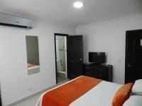 Postel nebo postele na pokoji v ubytování Hotel La Colonia