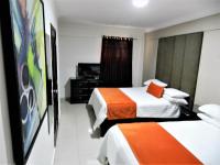 Postel nebo postele na pokoji v ubytování Hotel La Colonia
