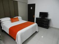 Postel nebo postele na pokoji v ubytování Hotel La Colonia
