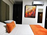 Postel nebo postele na pokoji v ubytování Hotel La Colonia