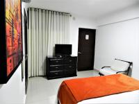 Postel nebo postele na pokoji v ubytování Hotel La Colonia