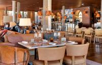 a dining room with a table and chairs at Lily of the Valley in La Croix-Valmer