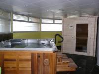 a large bath tub in a room with green walls at Hotel Europa in Quiberon